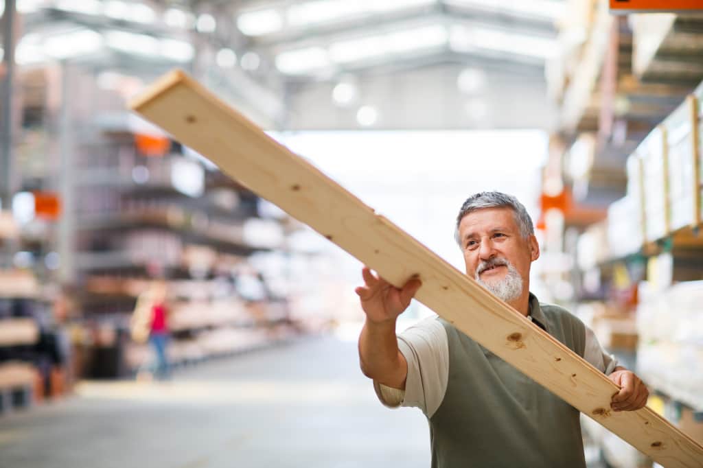 man buying lumber at Home Depot