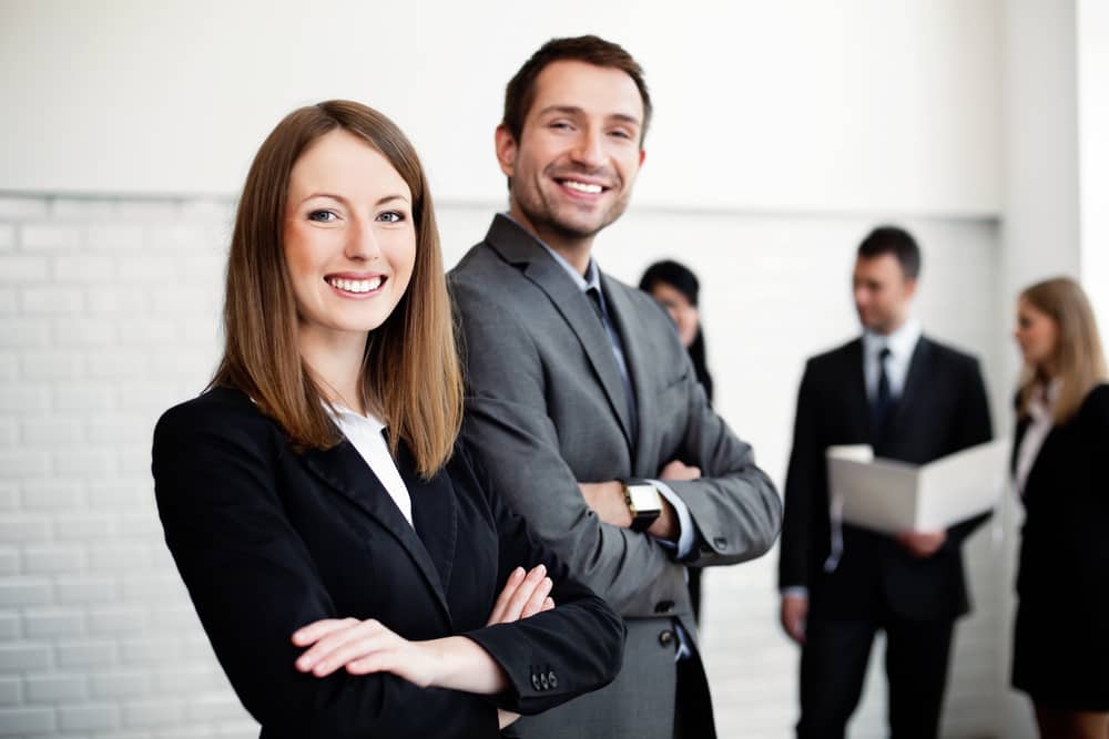Man and woman in office where leading and managing take place