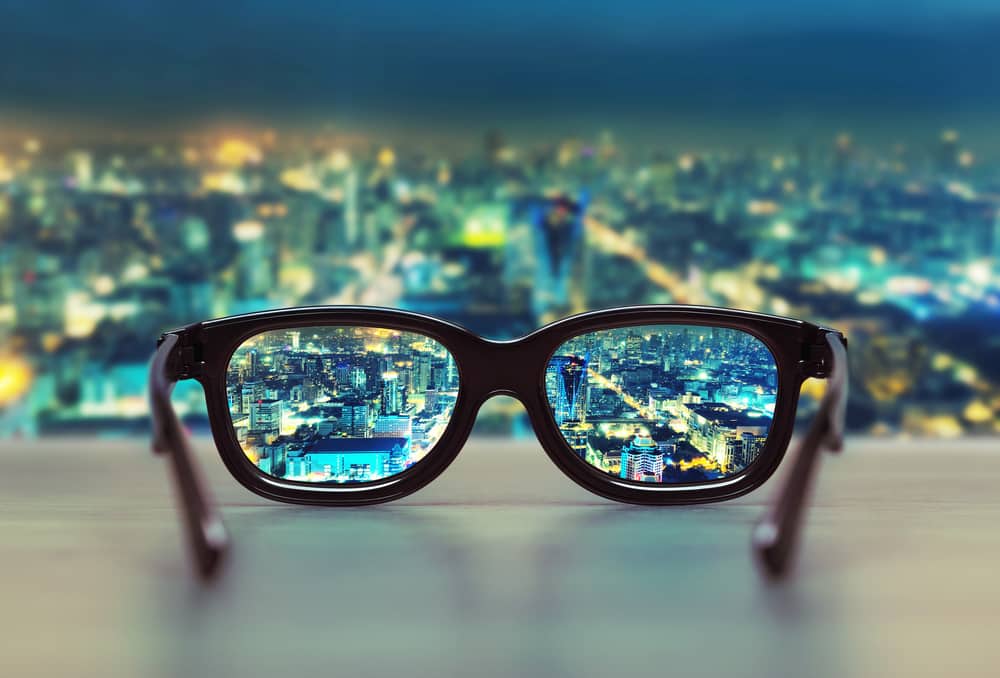 Eye glasses bringing a city into focus like the focus on efficiency and effectiveness.