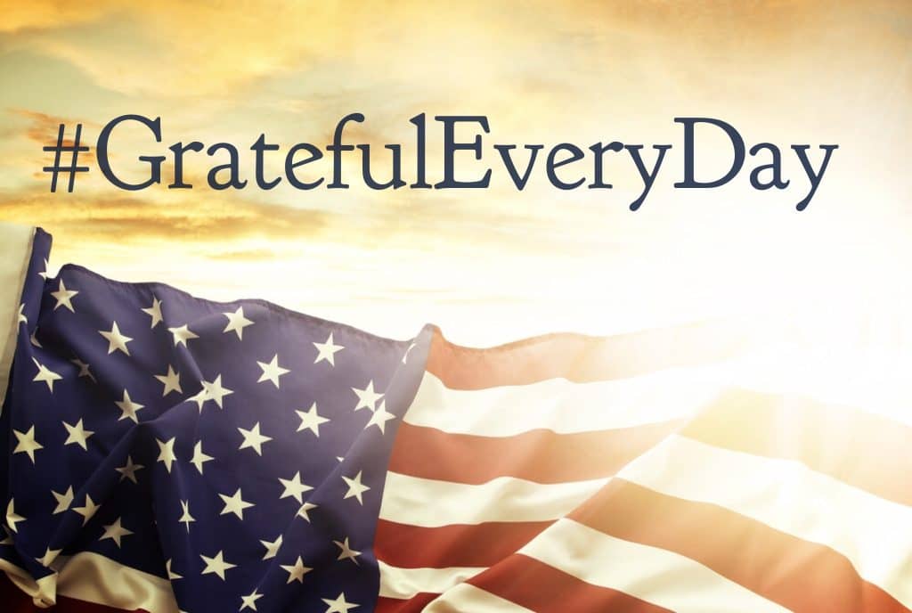 United States flag flying with GratefulEveryDay message